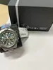 A watch and its packaging are placed on a white surface. Produktbild-Vorschau