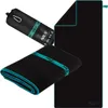 A black microfiber towel with teal trim is shown folded and rolled up in its carrying case, alongside an unfolded towel. Náhľad obrázku produktu