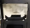 Interior view of a fireplace insert with ceramic lining and a metal grate. Náhled obrázku produktu