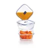 Three glass food storage containers are stacked on a white background. The top container is tilted and contains orange liquid. The middle container is empty. The bottom container is filled with sliced carrots. Produktbild-Vorschau