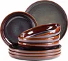 A stack of brown and dark gray plates and bowls. Voir les images du produit