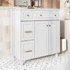 A white bathroom vanity with gold hardware sits on a patterned tile floor. Anteprima dell’immagine prodotto
