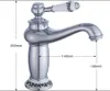 A silver faucet with a white handle decorated with a floral pattern, shown with dimensions indicated by dashed lines and text. Podgląd zdjęcia produktu
