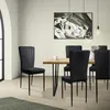 A dining room scene with a wooden table and black chairs. Náhled obrázku produktu
