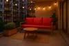 A balcony with outdoor furniture and string lights. Anteprima dell’immagine prodotto