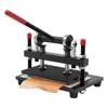 A manual stamping machine with a piece of leather on its base. Náhled obrázku produktu