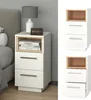A collage of a white bedside table with a wood-tone open shelf and two drawers, shown in a bedroom setting and as a standalone product image. Náhled obrázku produktu