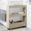 A slim storage cart with three shelves is placed next to a bathroom vanity. The cart is filled with various toiletries and towels. Náhľad obrázku produktu