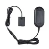 A black camera battery adapter and charger cable set is laid out on a white background. Náhled obrázku produktu