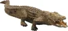 A realistic toy crocodile with its mouth open, shown from a side angle against a white background. Anteprima dell’immagine prodotto