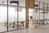 Modern office interior with glass partitions and workstations. Podgląd zdjęcia produktu
