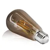 A single vintage-style LED light bulb with a smoky brown glass bulb and a silver metal screw base, lying on a reflective white surface. Náhľad obrázku produktu
