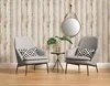 Two chairs in a room with wood-paneled wallpaper and a mirror. Produktbild-Vorschau
