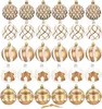 A collection of gold and white Christmas ornaments arranged in rows. Anteprima dell’immagine prodotto