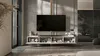A modern living room with a wall-mounted TV and entertainment unit. Produktbild-Vorschau