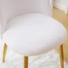 Close-up of a white fluffy chair seat with gold legs. Podgląd zdjęcia produktu