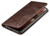 A brown leather flip cover for a smartphone is shown from a diagonal angle, with the cover partially open to reveal the phone screen. Produktbild-Vorschau