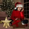 A woman in a Santa hat opens a glowing gift box next to a Christmas tree and a tree topper star. Produktbild-Vorschau
