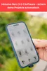 A hand holding a smartphone with a file management app open, with a blurred green background. Produktbild-Vorschau
