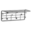 A black metal wall-mounted shelf and coat rack designed to resemble musical notation. Voir les images du produit