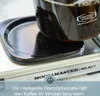 A close-up of a coffee carafe on a warming plate. Produktbild-Vorschau