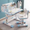 A child's desk and chair set with an astronaut theme, set up in a room. Produktbild-Vorschau