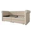 A beige upholstered daybed with two drawers underneath and a diamond-stitched headboard, shown from a side angle against a white background. Voir les images du produit