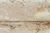 A close-up view of a rolled-up rug with a textured surface and a pattern of gold flecks. Anteprima dell’immagine prodotto