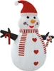 An inflatable snowman with a red hat and scarf, holding candy canes. Produktbild-Vorschau