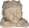 A close-up of a decorative planter shaped like a sleeping head. Podgląd zdjęcia produktu