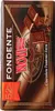 A close-up of a chocolate bar wrapper with a compass design and images of chocolate pieces. Voir les images du produit
