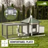 A chicken coop with an attached run, set up on a grassy lawn with trees in the background. Produktbild-Vorschau