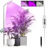 A floor lamp with a ring light illuminates several potted houseplants. Náhľad obrázku produktu
