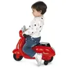 A young child sits on a red toy Vespa scooter. Náhľad obrázku produktu