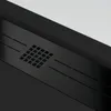 A close-up view of a black shower tray with a textured surface and a grid pattern. Produktbild-Vorschau