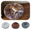 A dog lying in a round, fluffy dog bed, with three other dog beds shown below in different colors. Produktbild-Vorschau