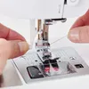 Close-up of hands threading a sewing machine needle. Produktbild-Vorschau
