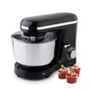 A black stand mixer with a silver bowl and three cupcakes in front of it, set against a white background. Produktbild-Vorschau