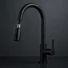 A black kitchen faucet with a pull-out spray head is shown against a dark, textured background. Produktbild-Vorschau