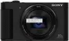 A black Sony Cyber-shot DSC-HX90 camera is shown from the front. Produktbild-Vorschau