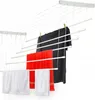 A ceiling-mounted clothes drying rack with several lines and clothes hanging on it. Náhled obrázku produktu
