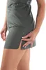 A close-up side view of a woman's torso and legs wearing a green dress. Anteprima dell’immagine prodotto