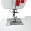 A close-up view of the needle and presser foot area of a white sewing machine. Produktbild-Vorschau