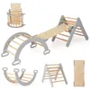 A collection of wooden climbing toys for children, including a climbing arch, a triangular climber with a slide, a rocker, and a climbing board. Voir les images du produit