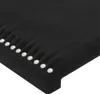 A close-up, angled view of a black upholstered headboard with decorative pearl-like studs along the edge. Produktbild-Vorschau