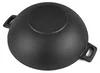 The bottom view of a black cast iron wok grill pan. Podgląd zdjęcia produktu