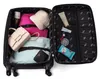 An open suitcase packed with clothing and accessories. Podgląd zdjęcia produktu