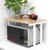 A microwave oven stand with bottles and a plant on top. Voir les images du produit