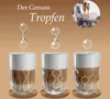 Three glasses of coffee with foam, showing the process of a drop falling into the liquid. Anteprima dell’immagine prodotto