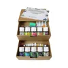 A set of paints and art supplies in a cardboard box. Anteprima dell’immagine prodotto
